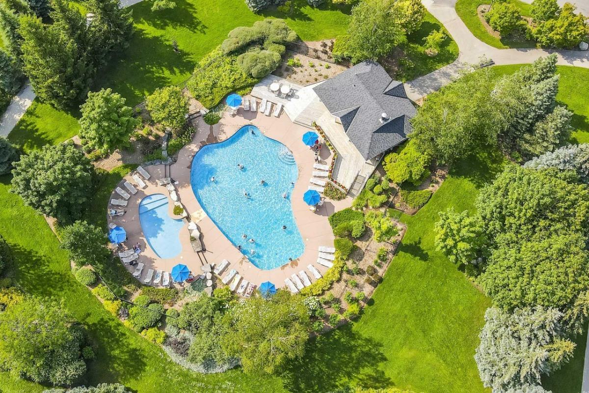 a birds eye view of a vacation rental in Ontario with a swimming pool