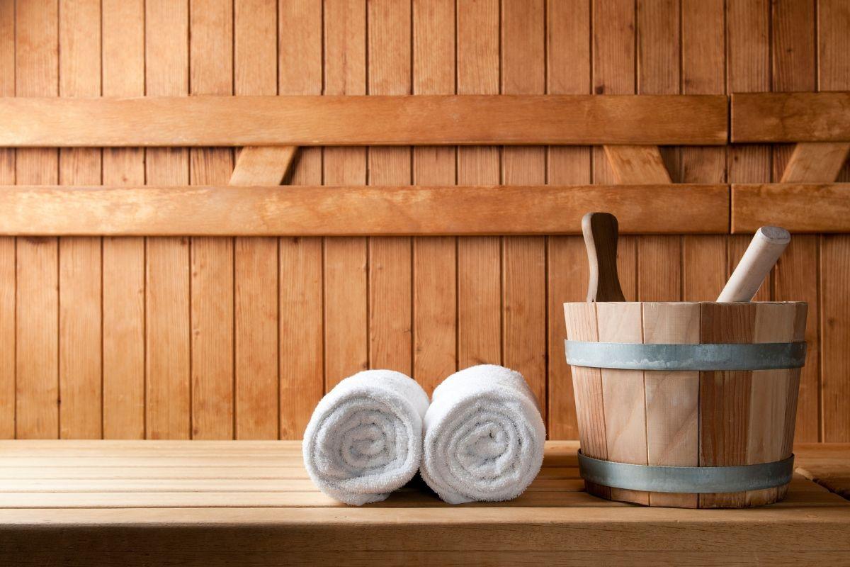 inside of a wooden sauna with towels in a vacation rental from Property Valet