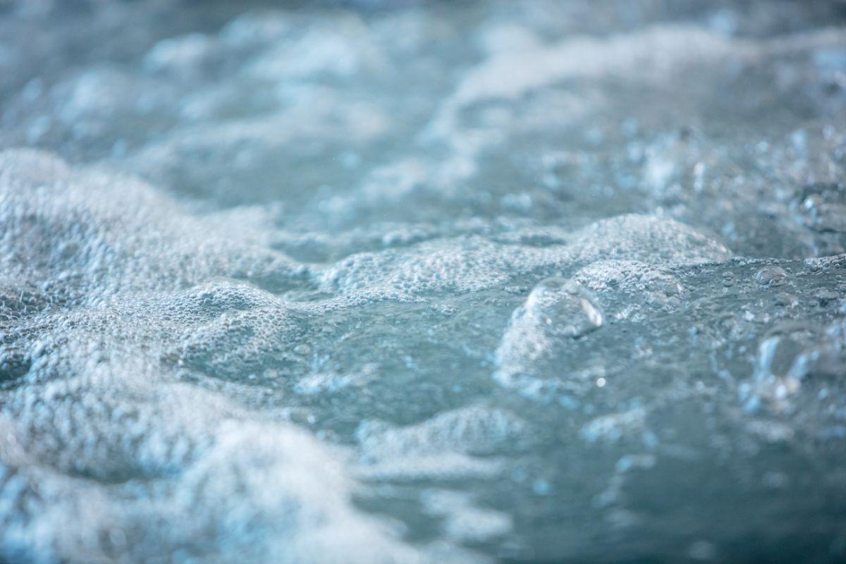 a close up shot of the hot bubbling water of a hot tub in a vacation rental